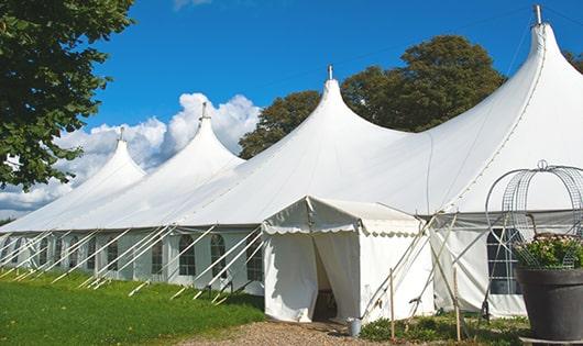 high-quality portable toilets stationed at a wedding, meeting the needs of guests throughout the outdoor reception in New Franken WI